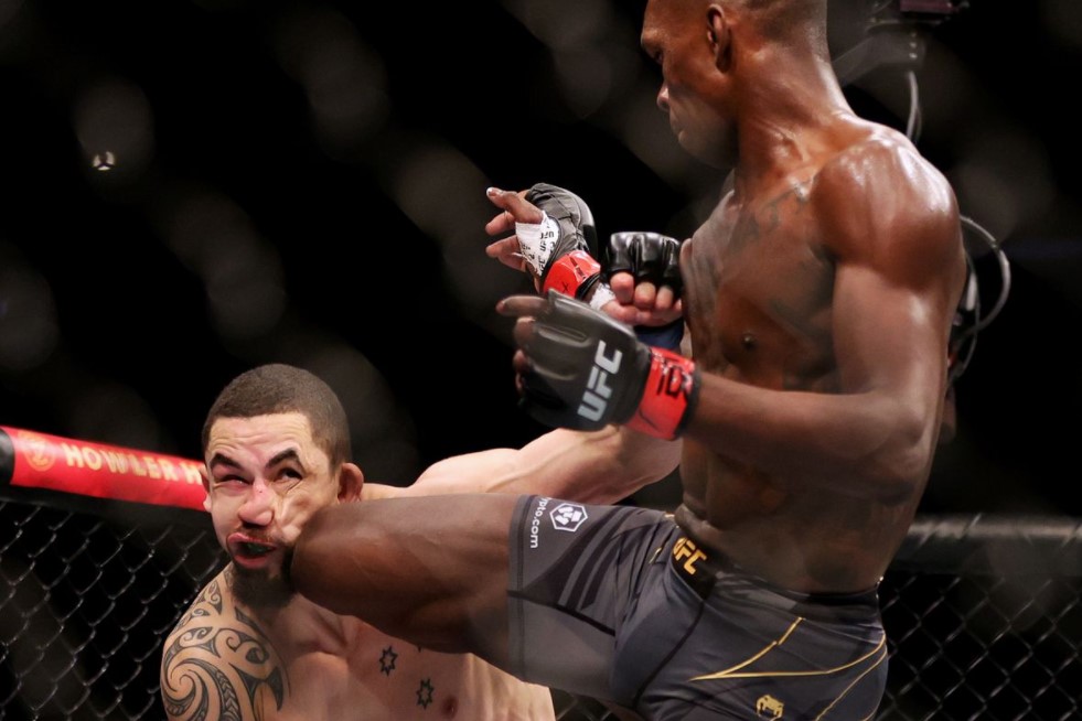 Featured image for “Israel Adesanya retains undefeated title after beating Robert Whittaker”