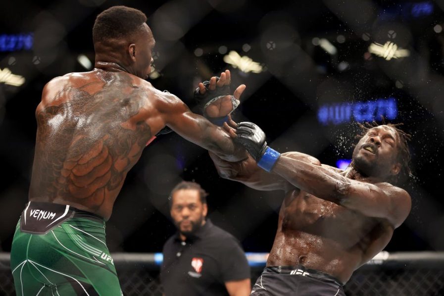 Featured image for “Israel Adesanya summons the Undertaker to destroy Jared Cannonier retaining UFC middleweight title”